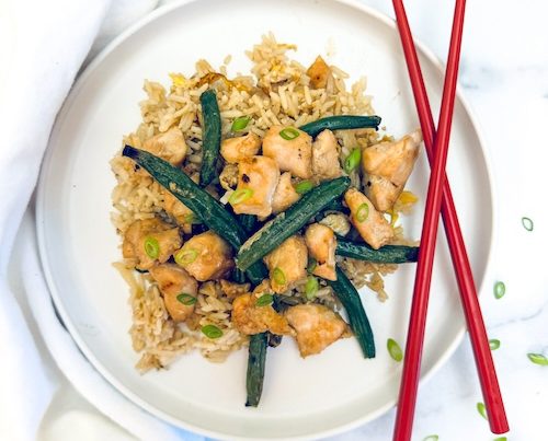 Sticky chicken and string beans over rice.