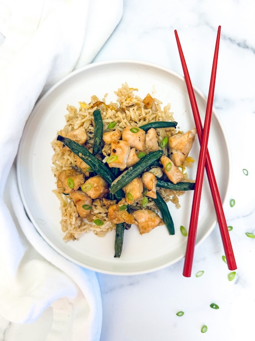 Sticky chicken and string beans over rice.