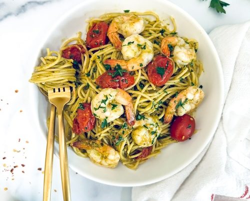 Pesto shrimp pasta in a bowl.
