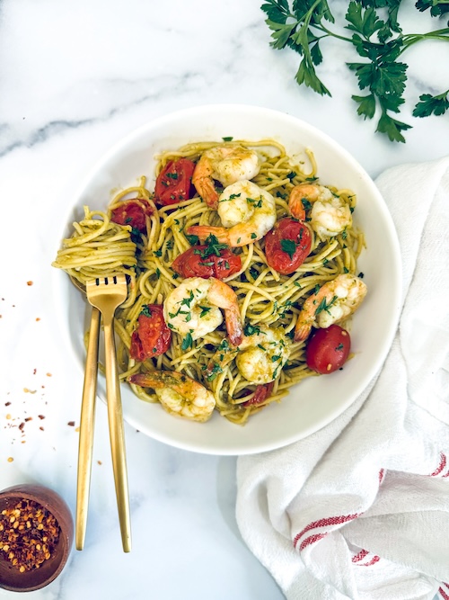 Pesto shrimp pasta in a bowl.