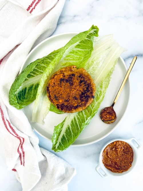 Pesto turkey burger in a lettuce wrap.