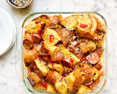Sausage egg and cheese bake in a casserole dish.