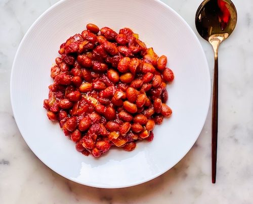 Vegetarian baked beans in a white bowl.
