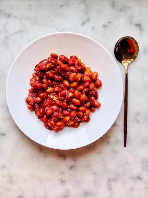 Vegetarian baked beans in a white bowl.