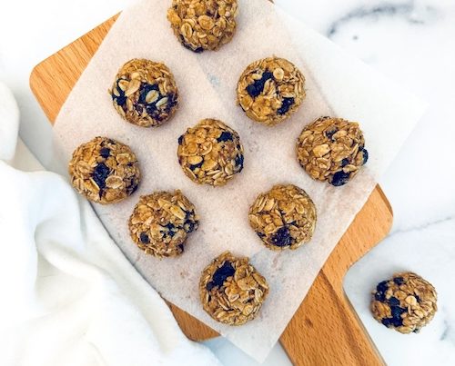 Oatmeal raisin granola bites on a cutting board.