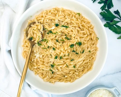 A bowl of garlic butter orzo pasta.