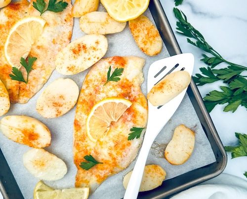 Flounder and potatoes on a sheet pan.