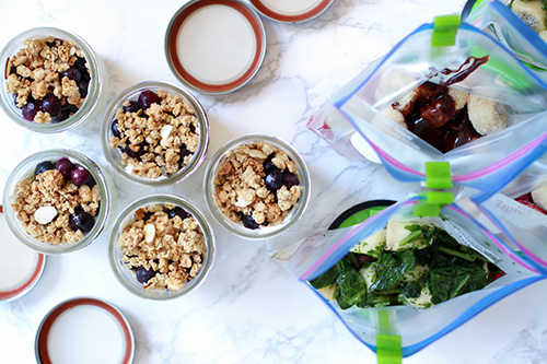 Fruit and yogurt parfaits in jars.