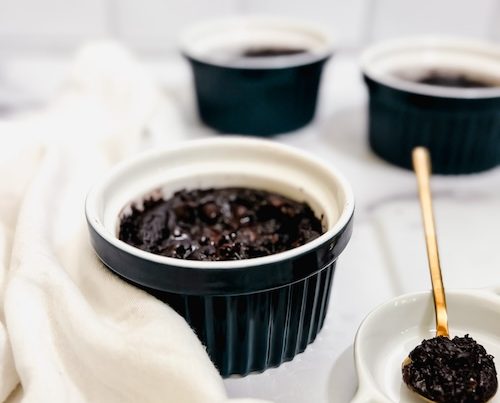 Ramekins of vegan molten chocolate lava cake.