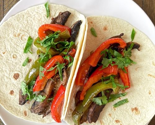 Vegan portobello fajitas in tortillas.
