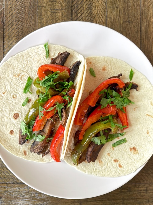 Vegan portobello fajitas in tortillas.