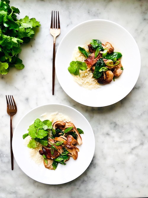 Two bowls of garlic honey chicken over rice.