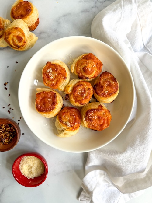 Pepperoni cheese rolls in a bowl.