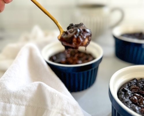 A spoon of molten chocolate lava cake.