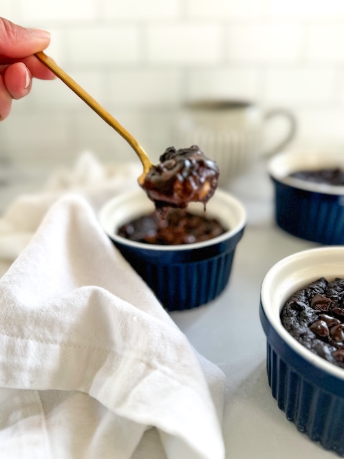 A spoon of molten chocolate lava cake.