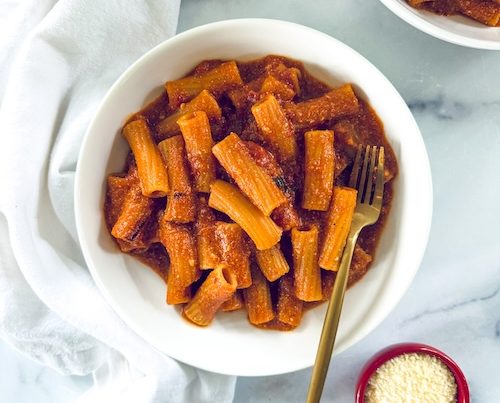 Two bowls of baked ziti.