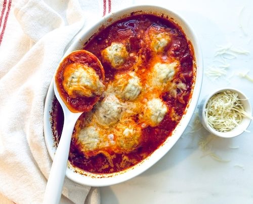 A platter of chicken meatball parmesan.