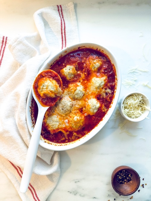 A platter of chicken meatball parmesan.