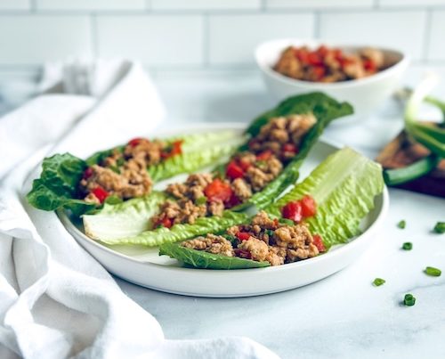 Chicken lettuce wraps on a plate.
