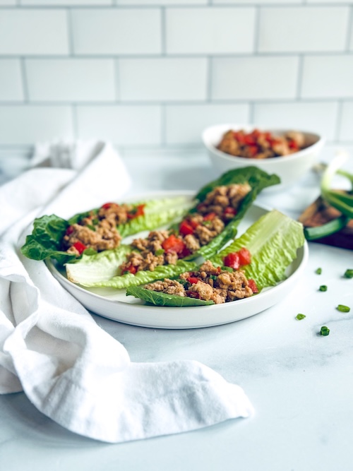 Chicken lettuce wraps on a plate.