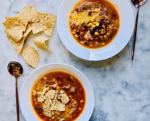 Two bowls of pork enchilada stew.