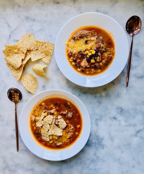 Two bowls of pork enchilada stew.