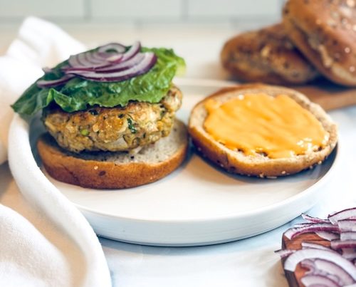 Chicken burger on a plate.