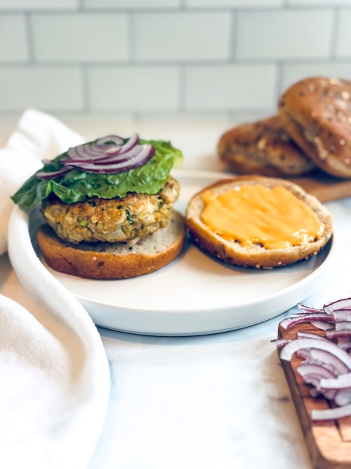 Chicken burger on a plate.