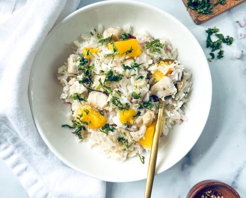 Mango chicken rice in a bowl.