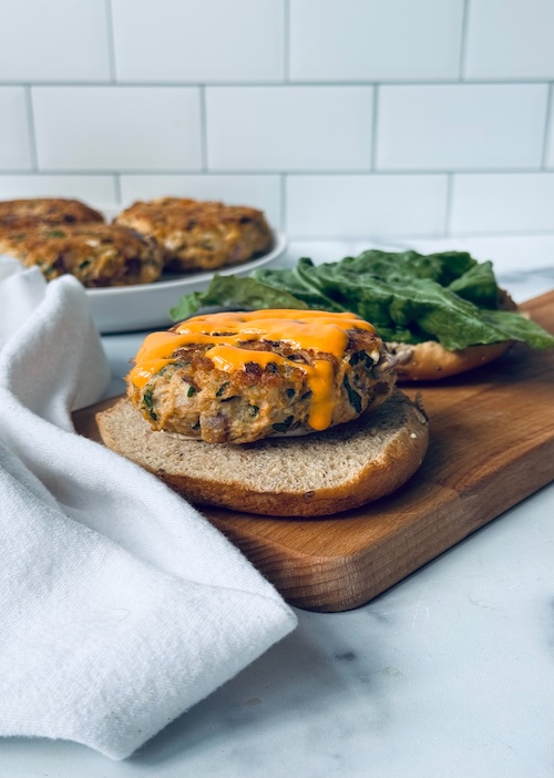 Chicken feta burger on a bun.