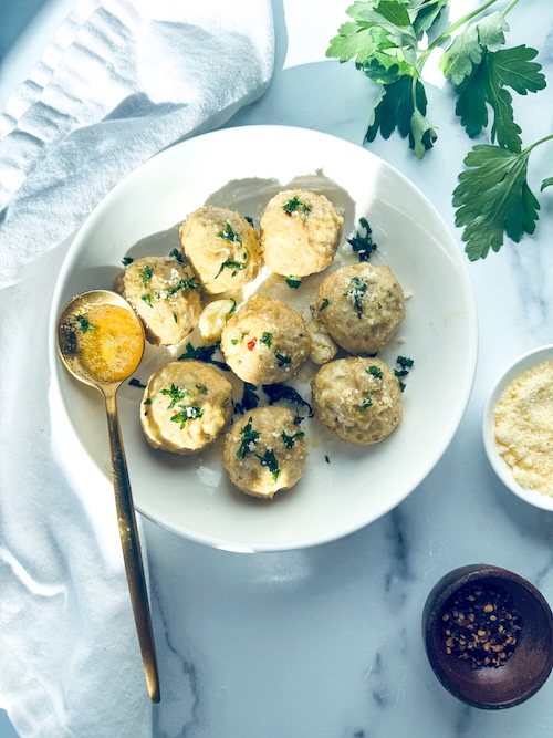 A plate of garlic butter meatballs.