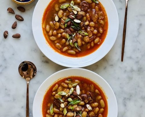 Bowls of Spanish bean and chorizo soup.