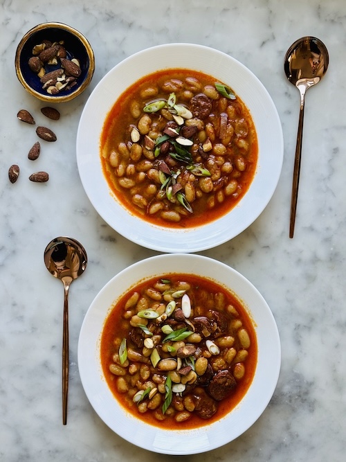 Bowls of Spanish bean and chorizo soup.