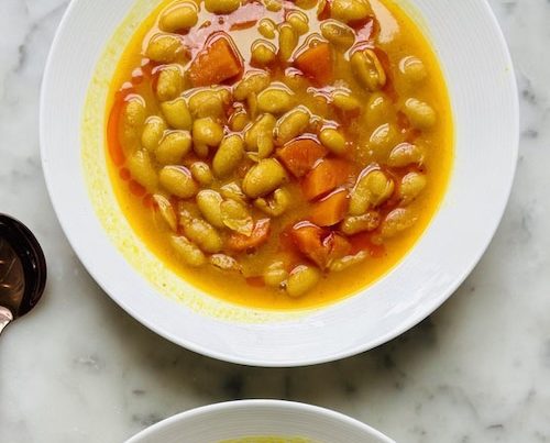 Bowls of turmeric white bean soup.