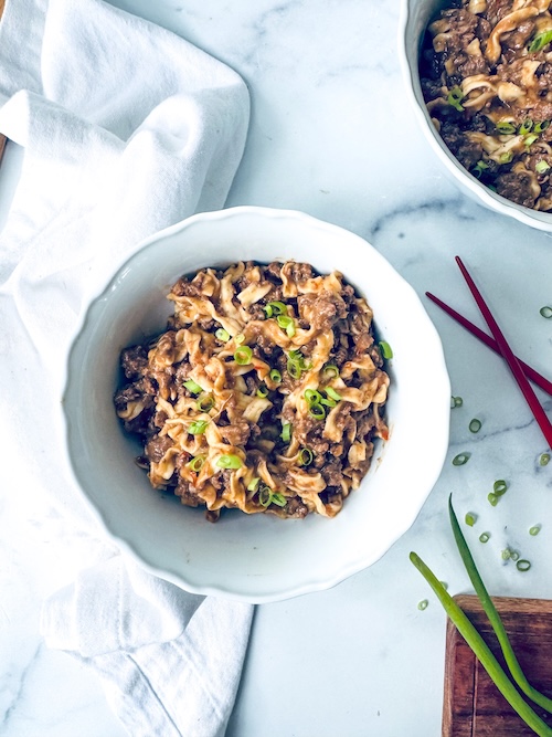 Bowl of ramen noodles with ground beef.