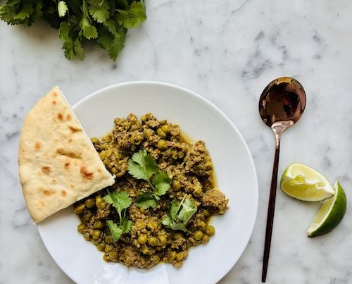 Indian spiced beef and peas in a bowl.