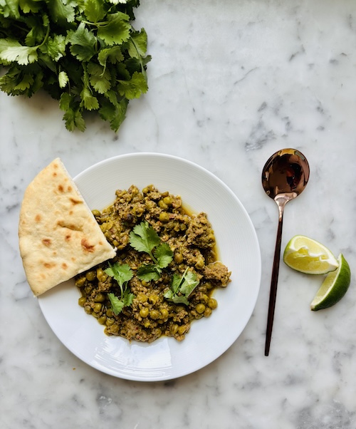 Indian spiced beef and peas in a bowl.