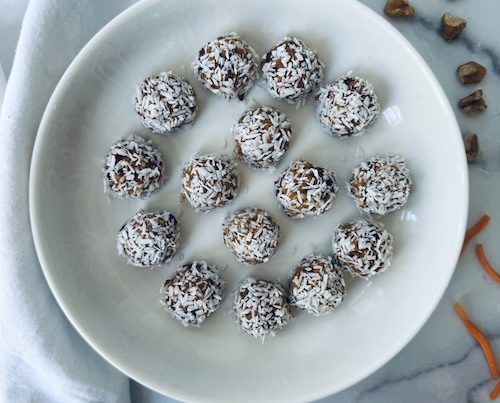 No bake carrot cake energy bites on a plate.