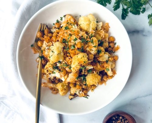 A bowl of chili lime cauliflower with chickpeas.