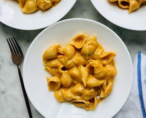 Small bowls of pumpkin macaroni and cheese.