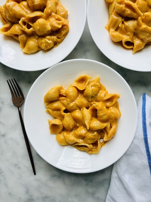 Small bowls of pumpkin macaroni and cheese.
