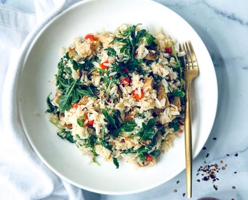 Italian sausage and arugula mixed with rice.