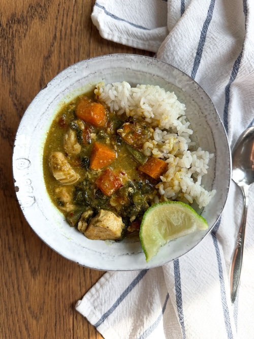 Bowl of chicken curry with rice.
