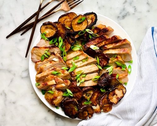 Sliced miso pork chops with mushrooms.