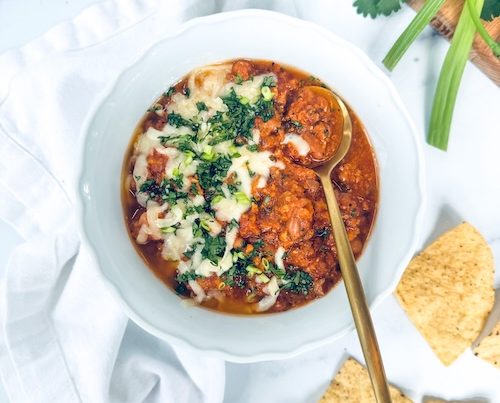 Cilantro lime turkey chili topped with cheese.
