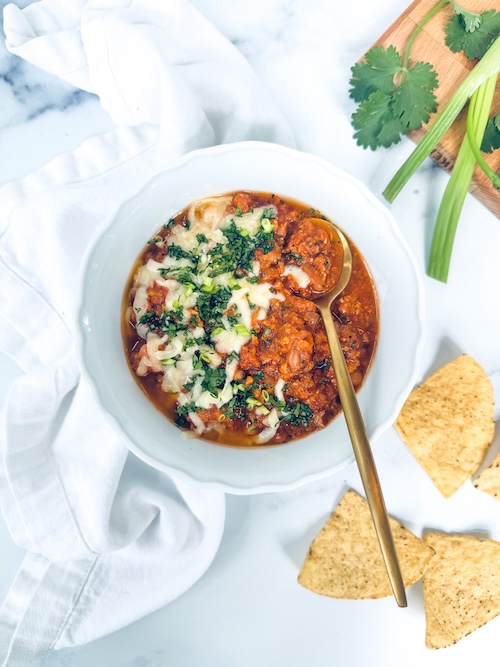 Cilantro lime turkey chili topped with cheese.