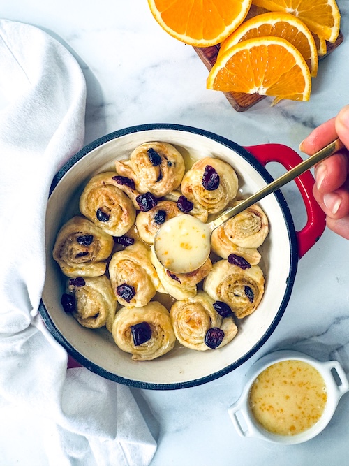Cranberry orange cinnamon rolls in a baking dish.