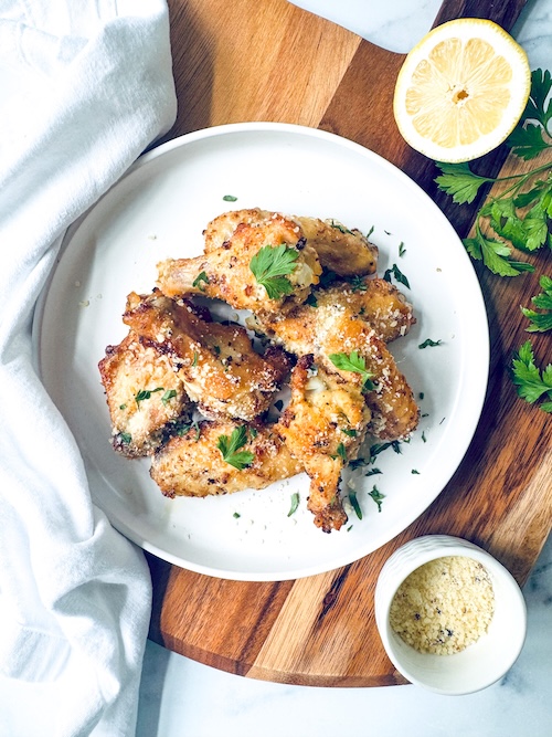 Baked chicken wings on a plate.