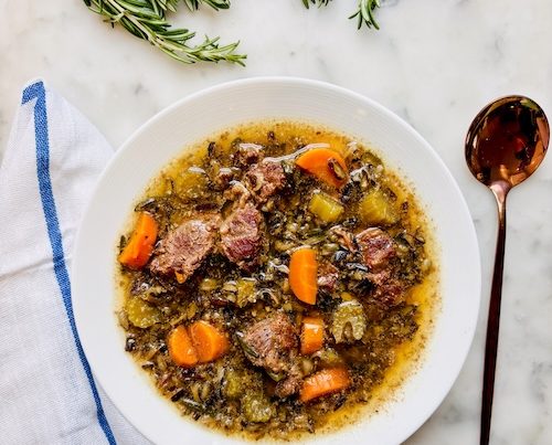 A bowl of beef and wild rice soup.