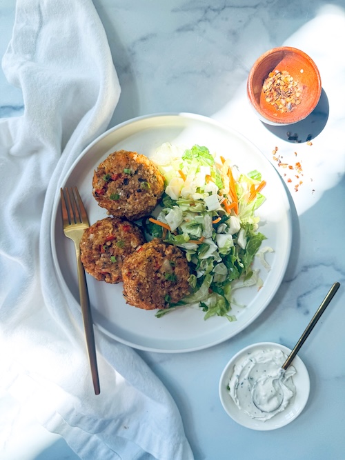 A plate with Cajun salmon cakes.